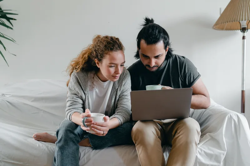 Couple calculating whether Bright Money subscription cost is worth it