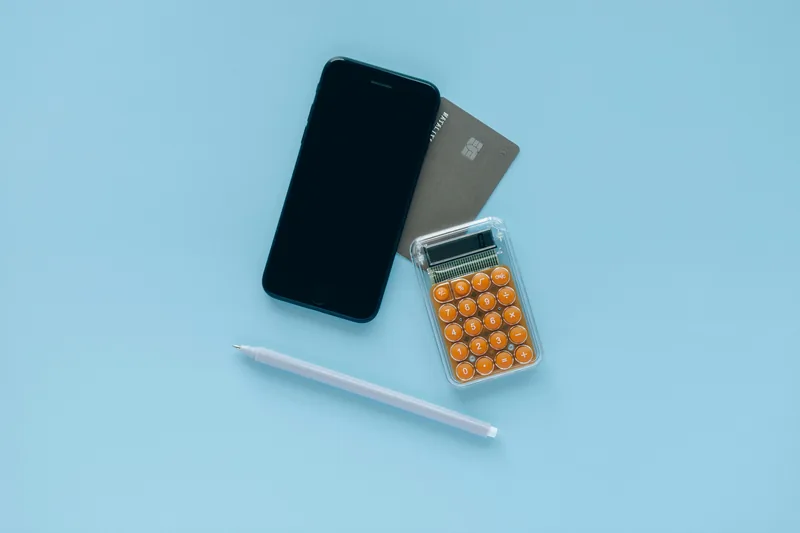 Bright Money pricing — phone, card, and calculator showing monthly vs annual plans