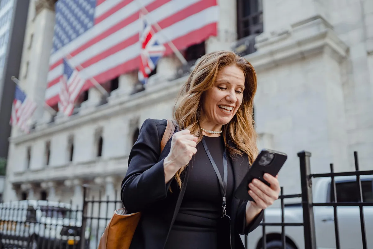 Happy Bright Money user checking debt payoff progress on phone